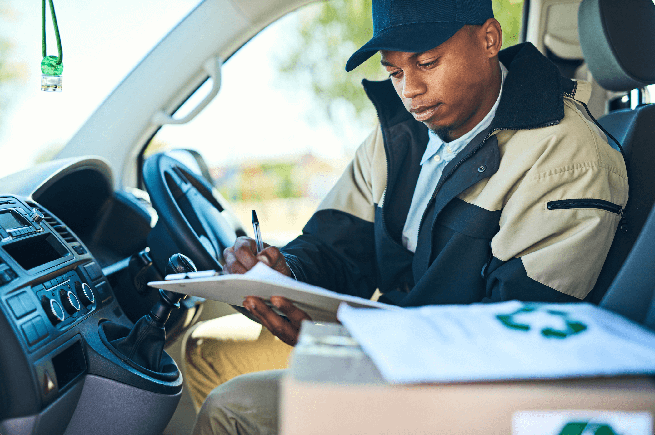courier writing in fleet vehicle